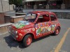 Highly decorated Fiat 500 outside Hotel Villa Bianca, Taormina, Sicily IT