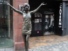 Cilla Black in front of the original entrance to the Cavern Club