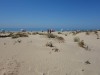 Some people sunbathe near Foz do Guadiana, Vila Real de Santo António PT